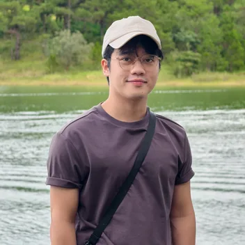 Tuan Tran Van standing by a lake